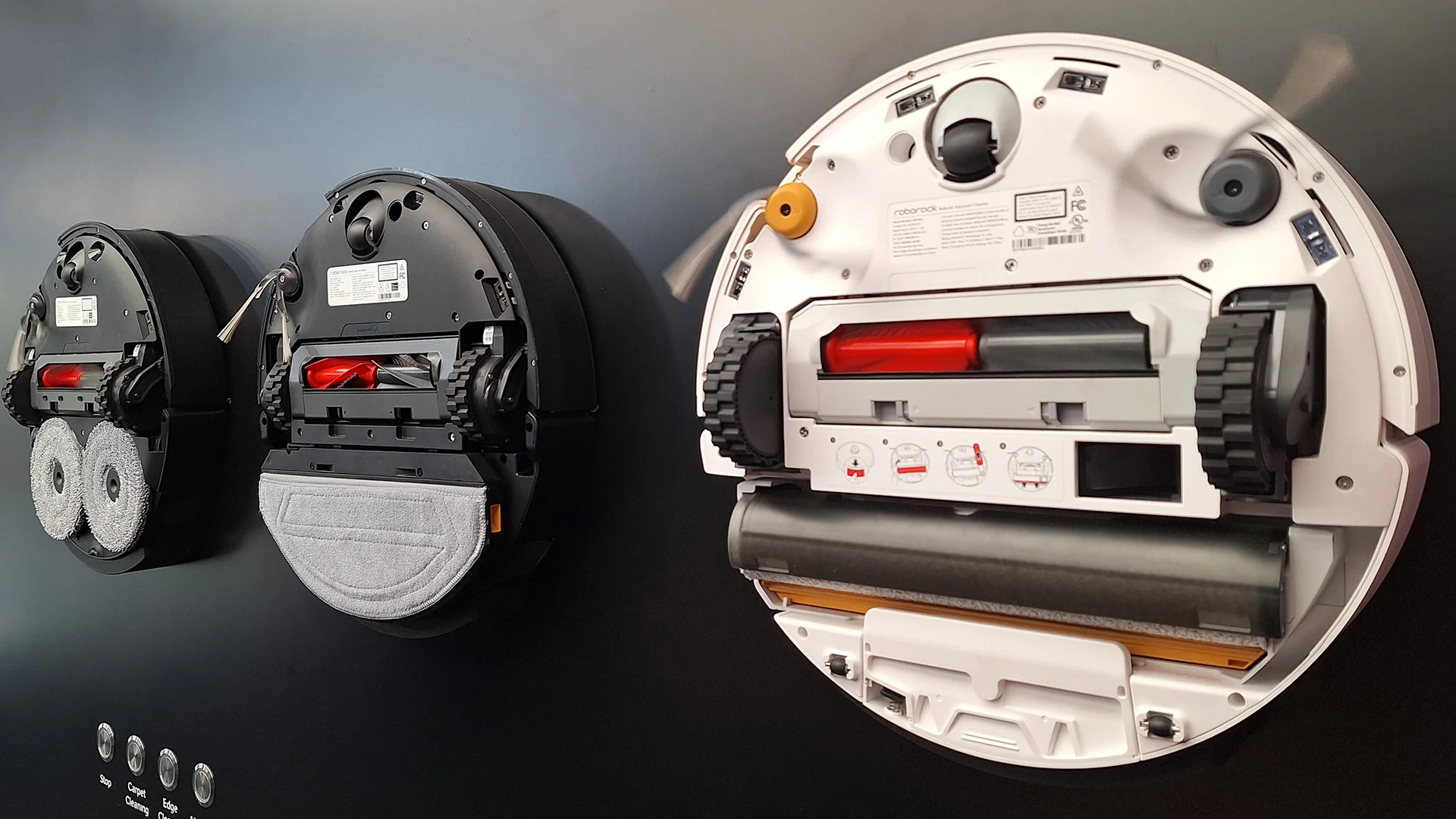 Roborock Saros 20, 20 Sonic and Qrevo Curv 2 robot vacuums flipped over to show mop system beneath