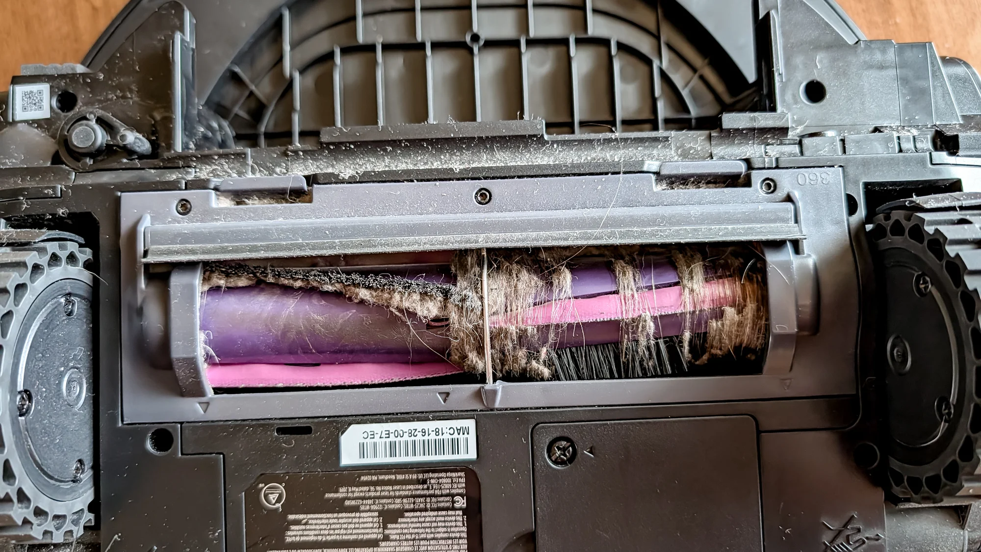 The underneath of a Shark UV Reveal PowerDetect Robot Vacuum